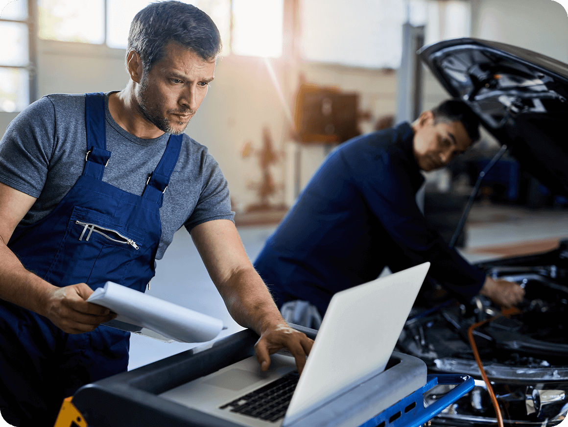Automotive technician completing onboarding training on tablet device